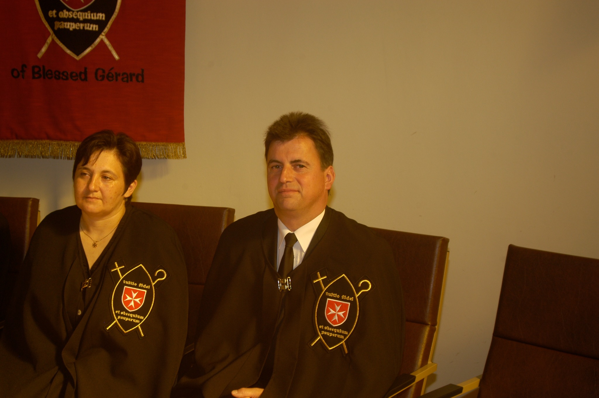 Gabriele and Maximilian Rauecker wearing the Brotherhood's cape on 26 June 2005
