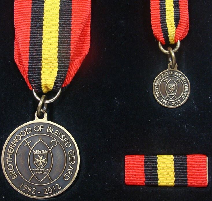 Reverse of the Brotherhood of Blessed Gérard Medal of Merit bearing the Brotherhood emblem and the dates 1992 to 2012
