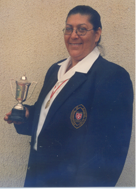 Caroline Beaumont holding the trophy of the first President’s Award of the Brotherhood of Blessed Gérard in 2000