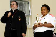 Father Gérard with Fikile Mthethwa at the presentation of the President’s Award for 2005