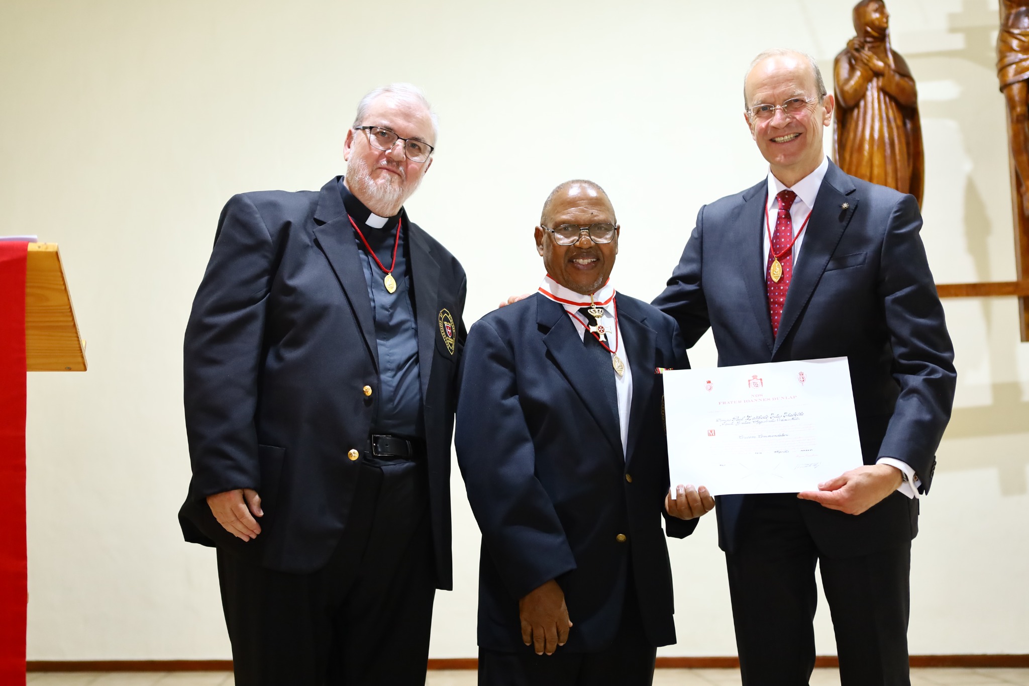 Major General Dr Josef D. Blotz presenting Dr Paul Thabethe with the certificate accompanying the Commander's Cross pro Merito Melitensi