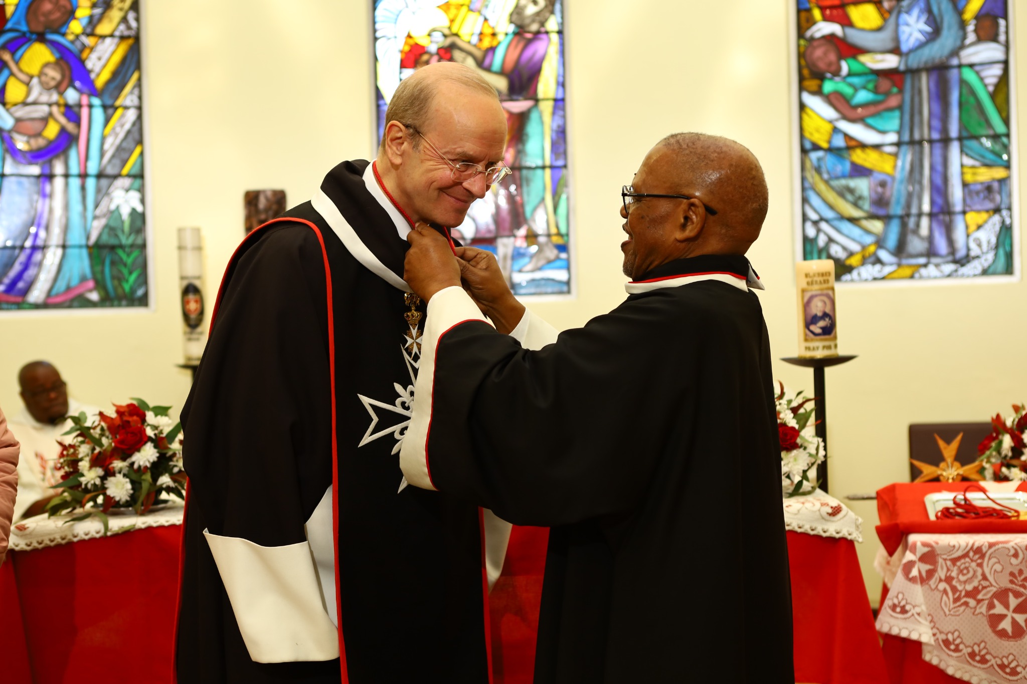 Dr Paul Thabethe presenting Major General Dr Josef D. Blotz with the membership medal of the Brotherhood of Blessed Gérard