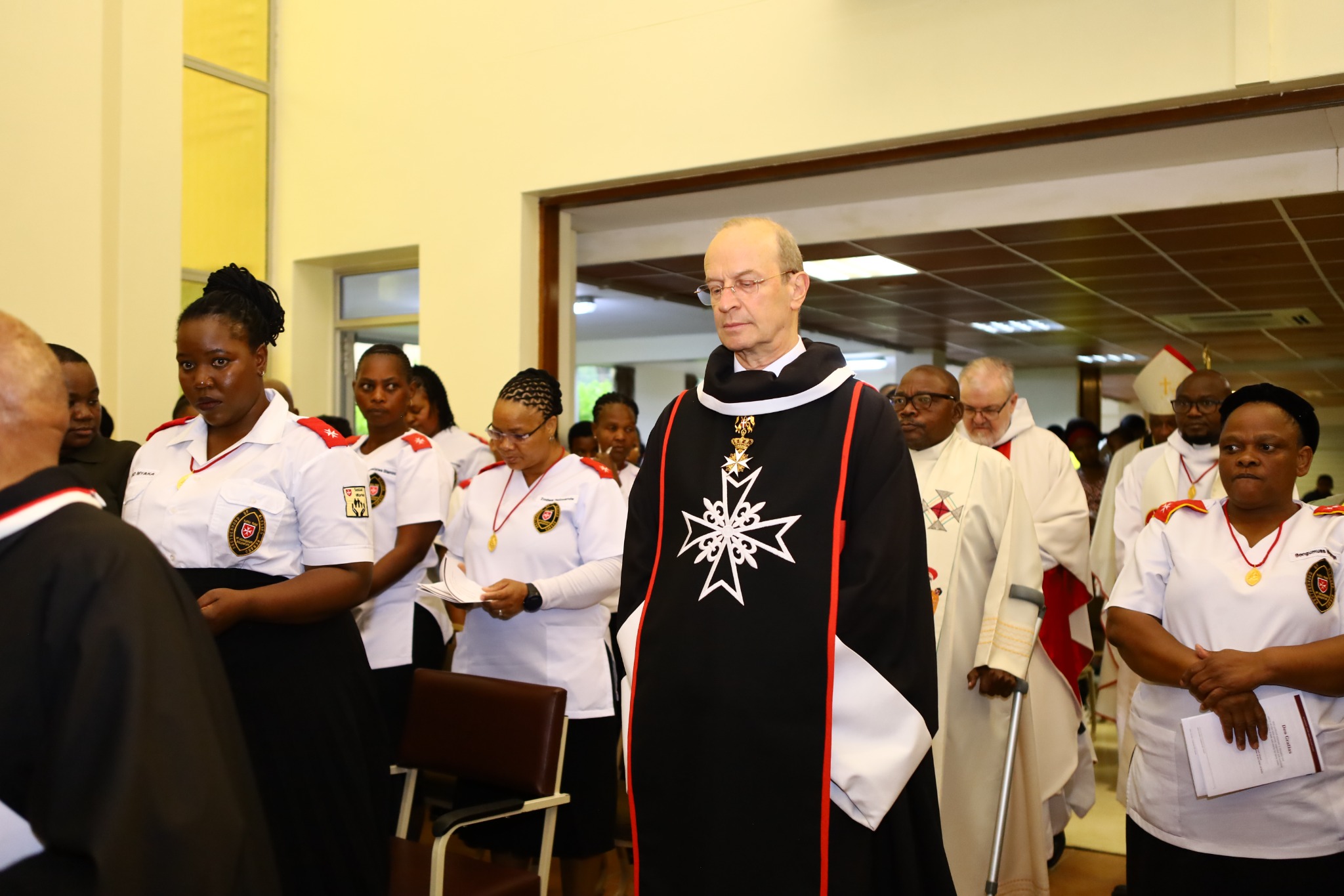 Major General Dr Josef D. Blotz entering the church in procession