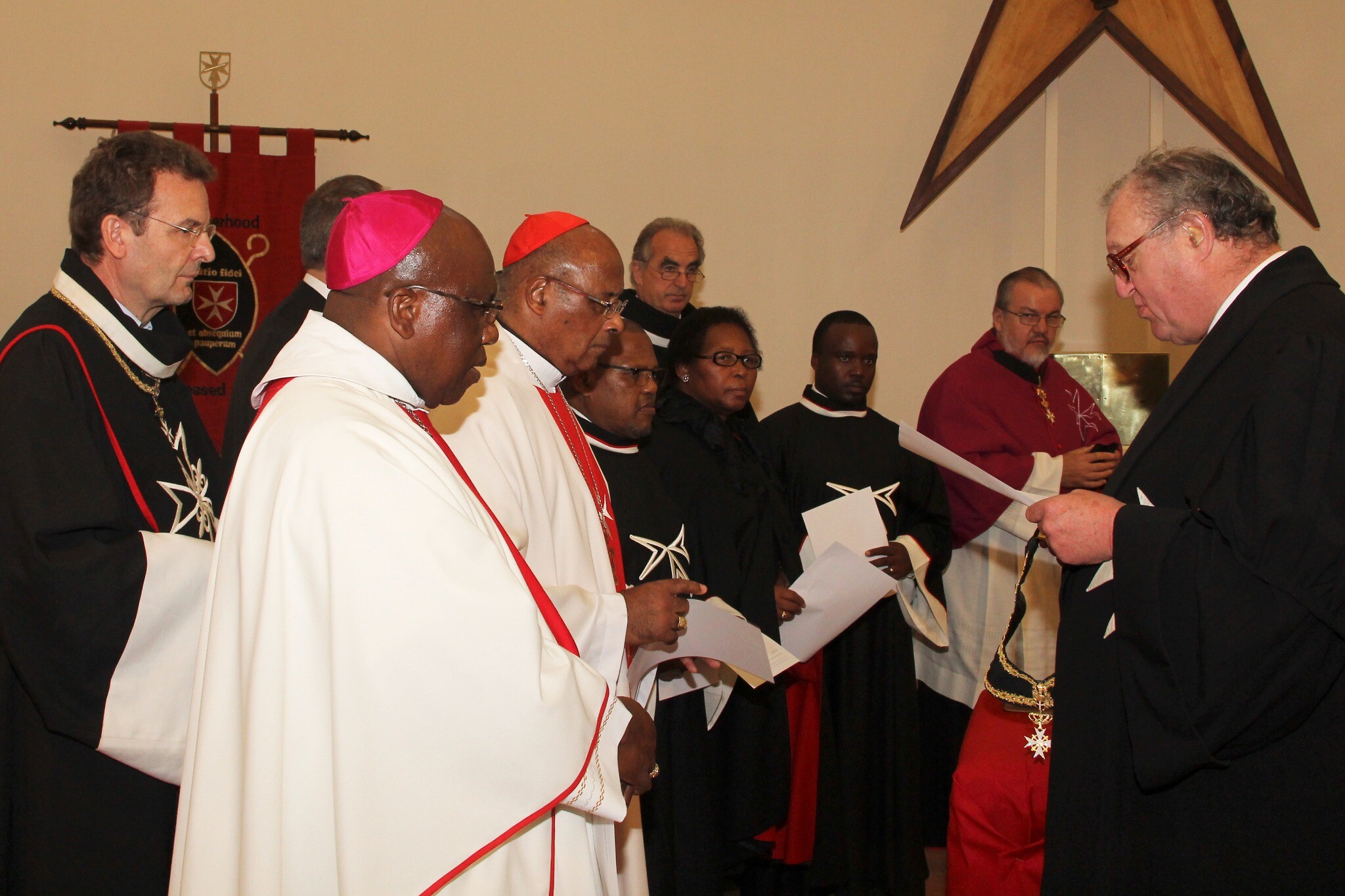 Grand Master Frà Matthew Festing conducting the investiture in Mandeni on 14 April 2014, with Cardinal Wilfrid Fox Napier, Bishop Xolelo Thaddeus Kumalo and the new members of the Order
