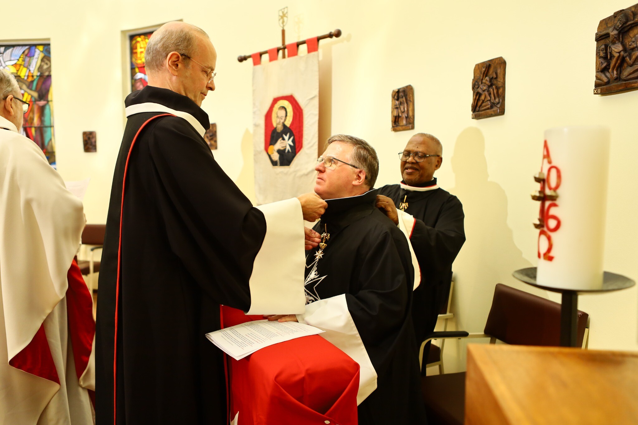 Dr Douglas Patrick Ross receiving the robes of a Knight of Magistral Grace during his investiture in Mandeni on 6 September 2026