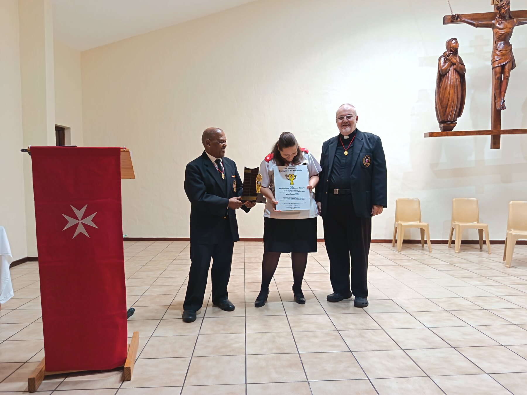 Tessa Hills receiving the President’s Employee of the Year Award for 2025