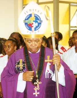 Bishop Mansuet Dela Biyase wearing the Grand Cross pro piis meritis conferred in 1996