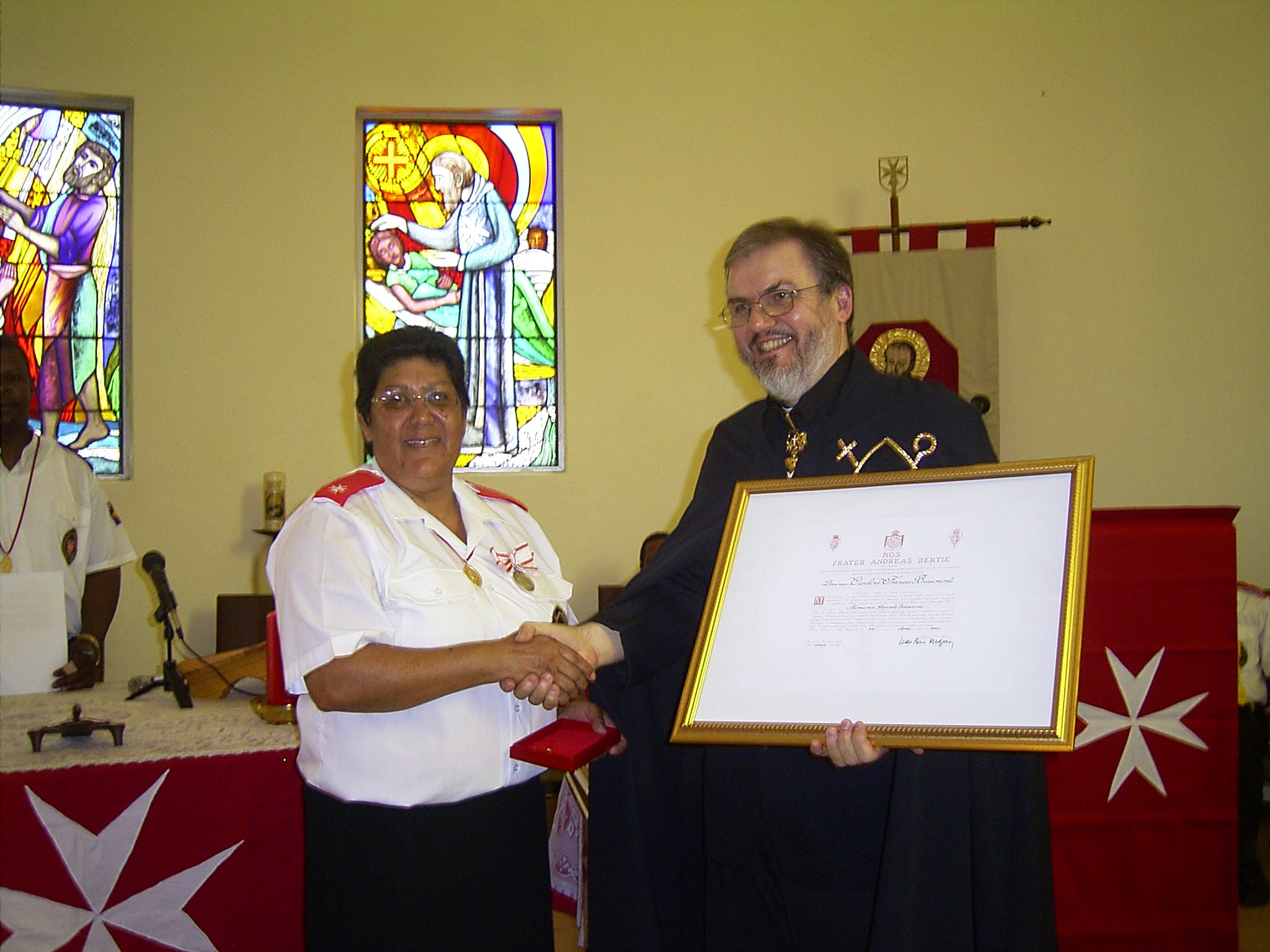 Caroline Beaumont receiving the Silver Medal pro Merito Melitensi