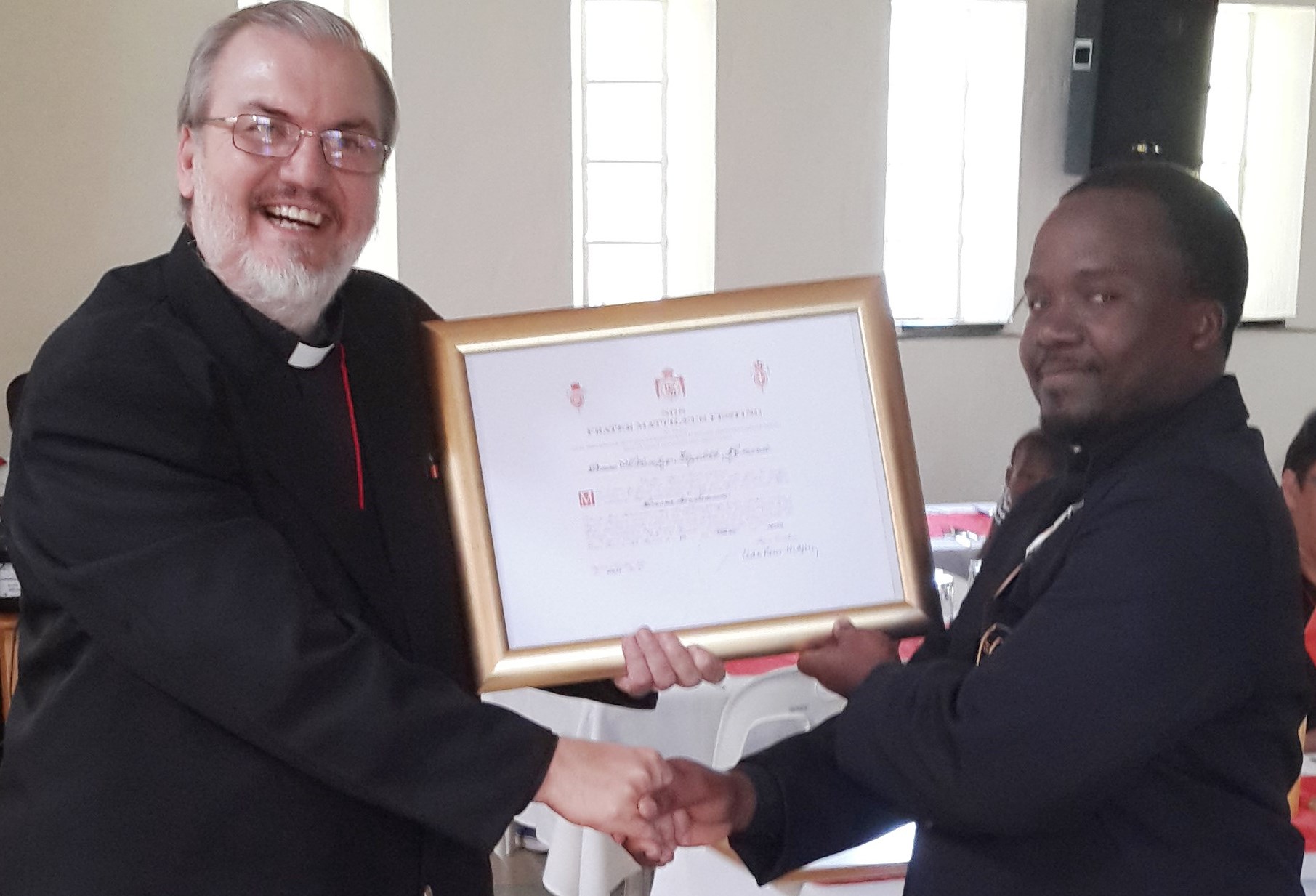 Dr Khaya Nzimande receiving the Bronze Medal pro Merito Melitensi