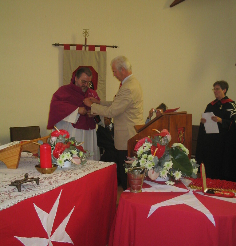 Dr Peter Freiherr von Fürstenberg presenting Father Gérard with the insignia of a Conventual Chaplain ad honorem in Mandeni on 16 October 2005